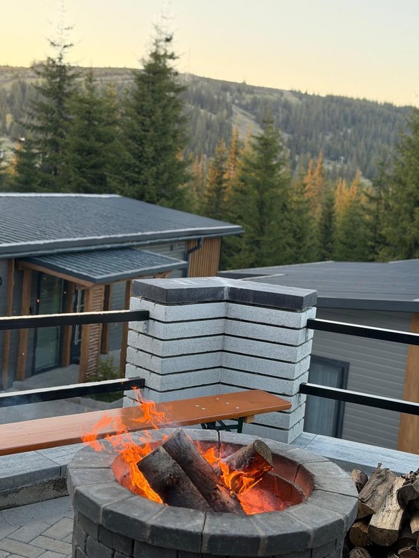 Outdoor firepit gathering at Nivalis Resort in Buscat